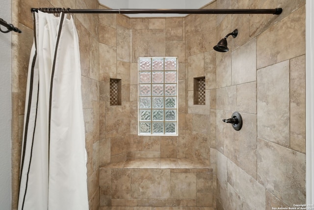 full bathroom featuring a tile shower