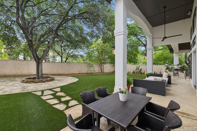view of patio / terrace featuring ceiling fan, outdoor dining space, and outdoor lounge area