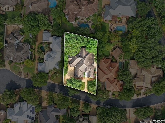 aerial view of residential area with property boundaries highlighted