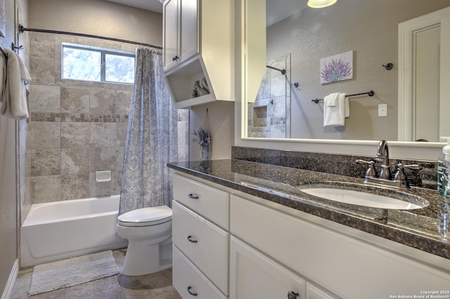 bathroom featuring vanity, shower / bath combo with shower curtain, and toilet