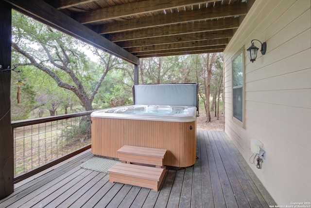wooden terrace with a hot tub