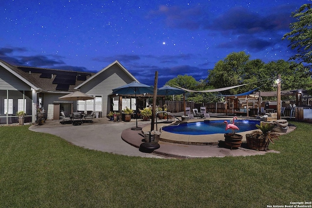 view of pool featuring a lawn, fence, a fenced in pool, and a patio