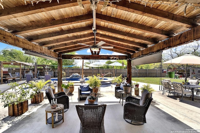 view of patio / terrace with a gazebo, a fenced backyard, and outdoor dining space
