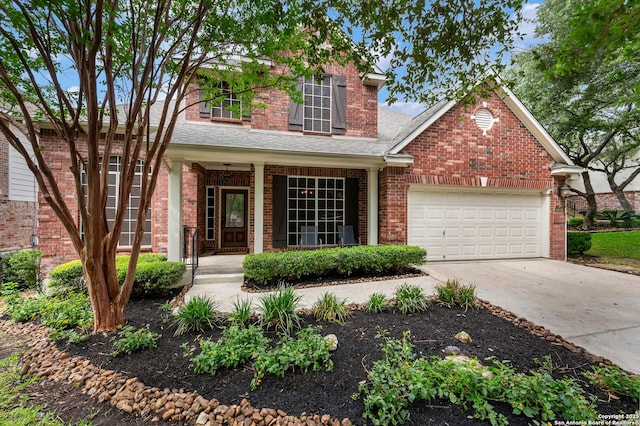 18607 Double Frk, San Antonio, TX 78258 - traditional-style house with a shingled roof, brick siding, a garage, concrete driveway, and covered porch