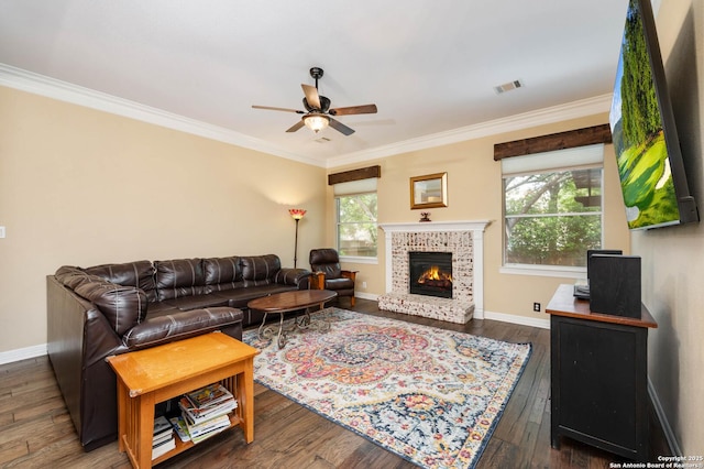 18607 Double Frk, San Antonio, TX 78258 - living room with crown molding, baseboards, ceiling fan, and a fireplace