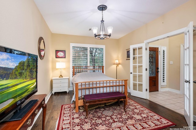 18607 Double Frk, San Antonio, TX 78258 - bedroom with an inviting chandelier, wood-type flooring, and french doors