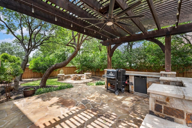 18607 Double Frk, San Antonio, TX 78258 - view of patio / terrace with a fenced backyard, ceiling fan, and a fire pit