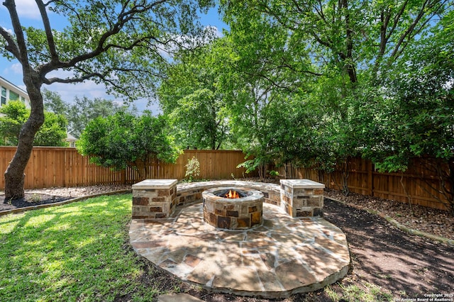 18607 Double Frk, San Antonio, TX 78258 - view of patio / terrace with a fenced backyard and a fire pit
