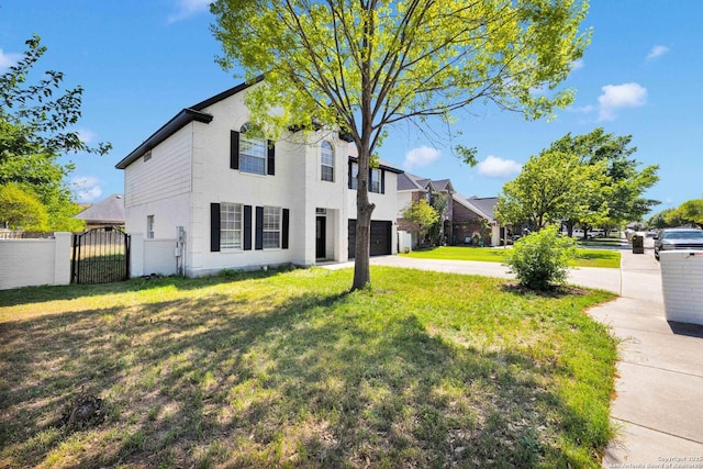 view of front of home with fence, an attached garage, a front lawn, a gate, and driveway
