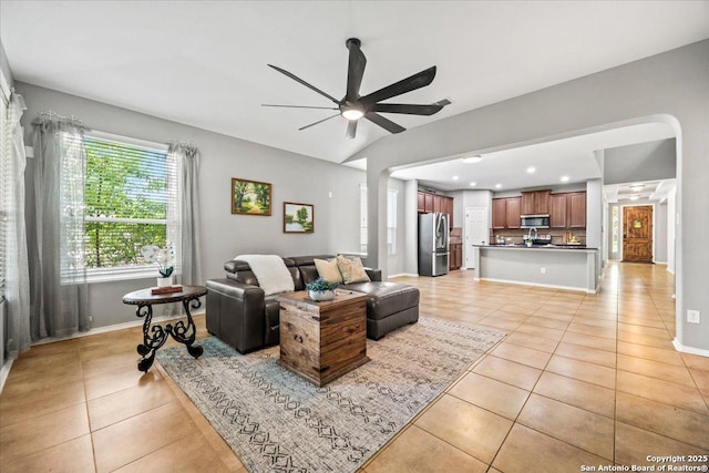 living area featuring baseboards, recessed lighting, ceiling fan, and light tile patterned floors