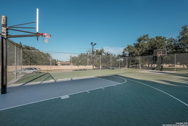 view of sport court featuring fence and community basketball court