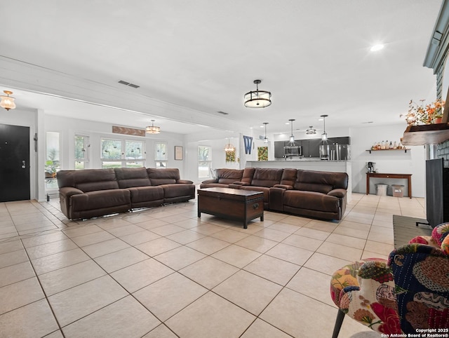 23 Sunrise, Pleasanton, TX 78064 - living room with light tile patterned flooring and visible vents