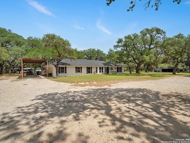 23 Sunrise, Pleasanton, TX 78064 - single story home with dirt driveway and a carport