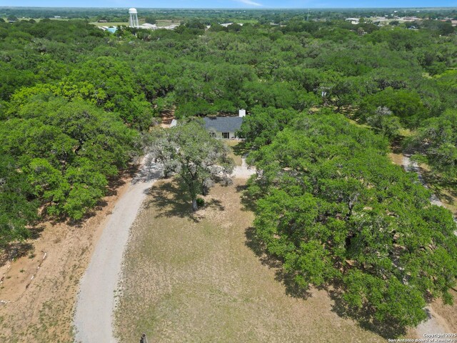 23 Sunrise, Pleasanton, TX 78064 - birds eye view of property with a forest view