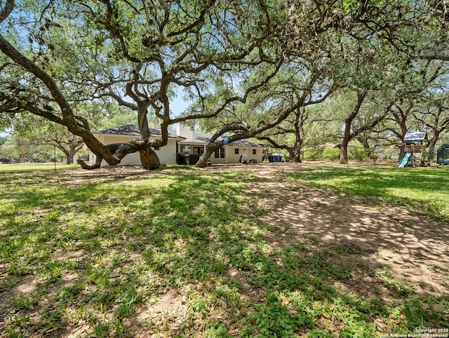 23 Sunrise, Pleasanton, TX 78064 - view of yard with a playground