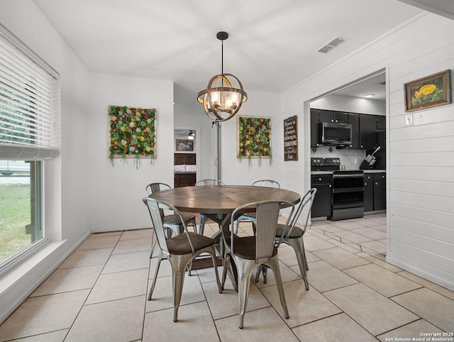 23 Sunrise, Pleasanton, TX 78064 - dining room featuring an inviting chandelier, light tile patterned floors, and visible vents