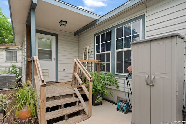 view of exterior entry featuring central AC