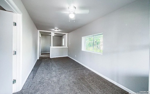 204 Division, San Antonio, TX 78214 - unfurnished room featuring baseboards, a ceiling fan, and dark colored carpet
