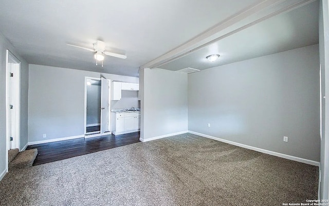 204 Division, San Antonio, TX 78214 - unfurnished room featuring dark colored carpet, baseboards, and ceiling fan