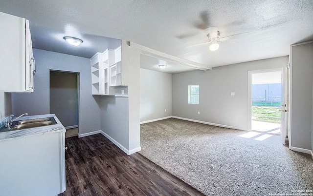 204 Division, San Antonio, TX 78214 - kitchen featuring white cabinets, ceiling fan, baseboards, and a sink