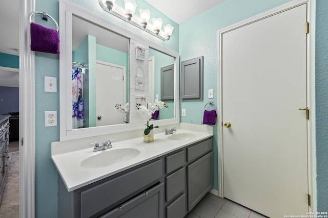 5211 Wood Gln, San Antonio, TX 78244 - full bathroom featuring a sink, tile patterned floors, and double vanity