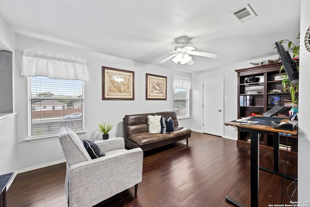 5211 Wood Gln, San Antonio, TX 78244 - living room featuring ceiling fan, visible vents, dark wood-style floors, and baseboards