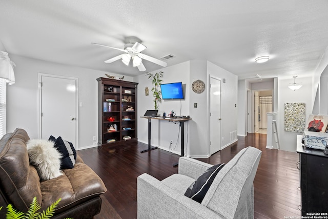 5211 Wood Gln, San Antonio, TX 78244 - living area with a ceiling fan, baseboards, visible vents, and wood finished floors