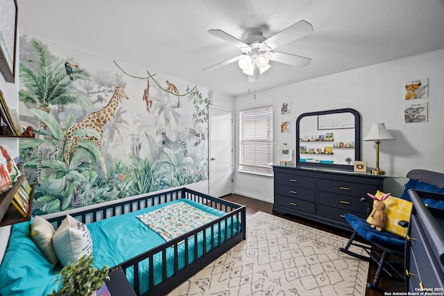 5211 Wood Gln, San Antonio, TX 78244 - bedroom with ceiling fan and wood finished floors