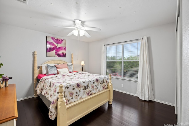 5211 Wood Gln, San Antonio, TX 78244 - bedroom with a ceiling fan, baseboards, and hardwood / wood-style flooring