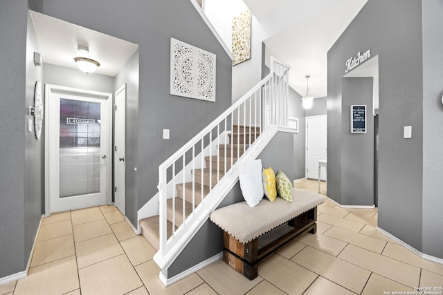 5211 Wood Gln, San Antonio, TX 78244 - stairs featuring tile patterned floors and baseboards