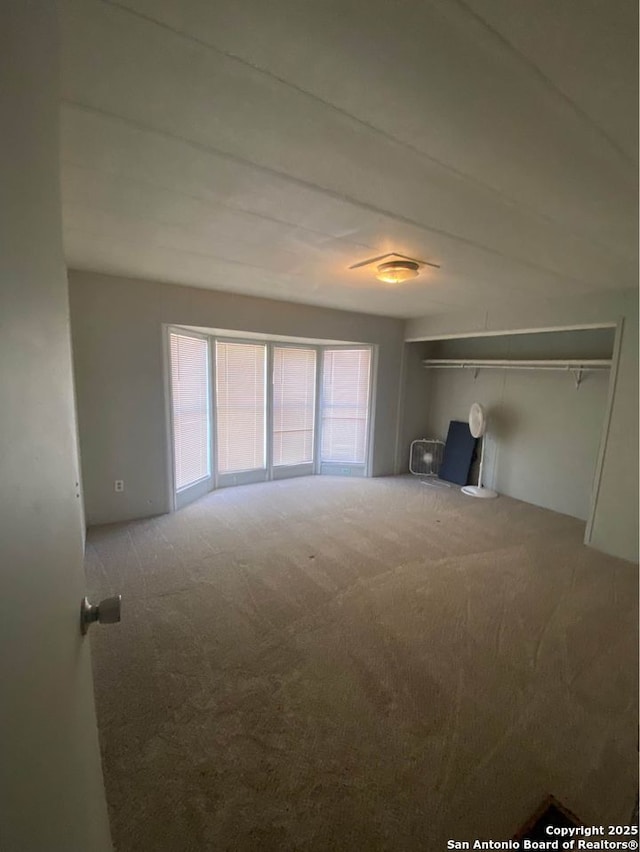 unfurnished living room with carpet floors