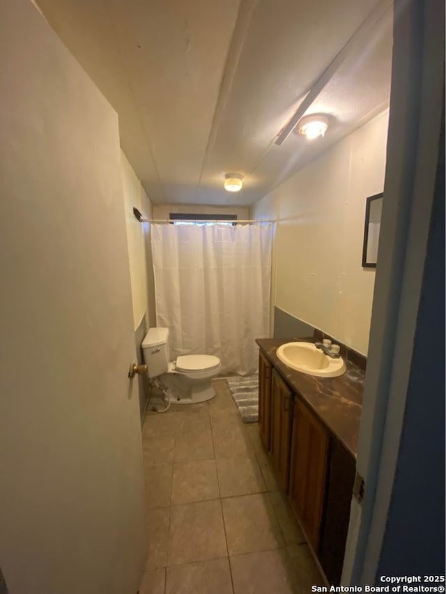 full bathroom with vanity, tile patterned flooring, toilet, and a shower with shower curtain