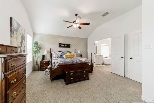 bedroom featuring multiple windows, light carpet, visible vents, and lofted ceiling