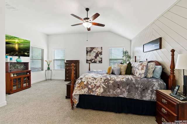 bedroom with carpet flooring, a ceiling fan, baseboards, lofted ceiling, and visible vents