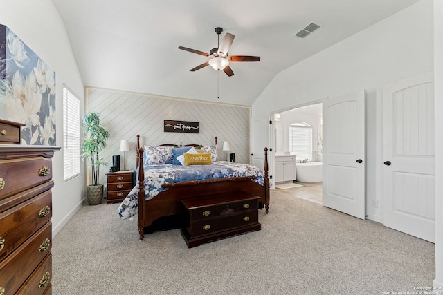 bedroom with carpet floors, vaulted ceiling, multiple windows, and visible vents