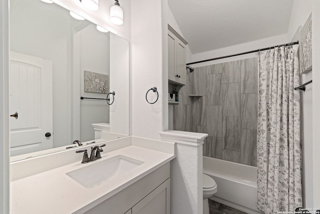 full bath featuring vanity, toilet, and shower / tub combo