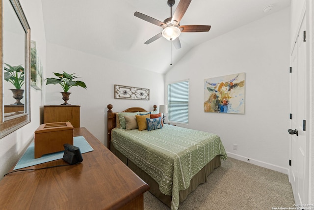 carpeted bedroom with baseboards, a ceiling fan, and vaulted ceiling
