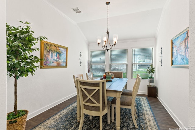 dining space with baseboards, a notable chandelier, ornamental molding, and dark wood-type flooring