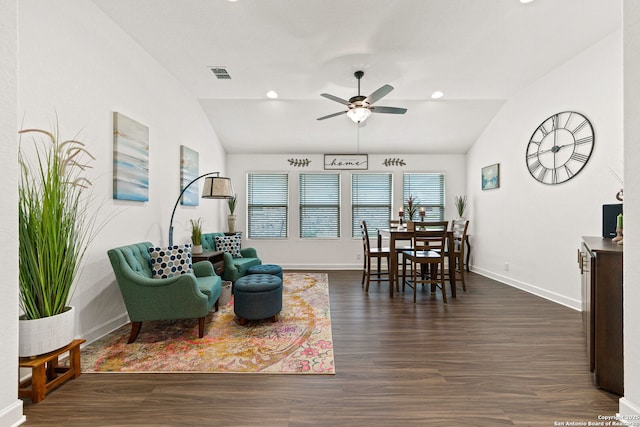 living room with visible vents, a ceiling fan, dark wood finished floors, and lofted ceiling