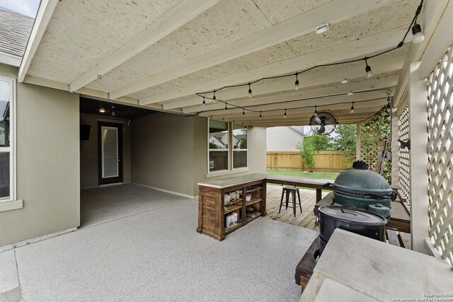 view of patio / terrace featuring fence