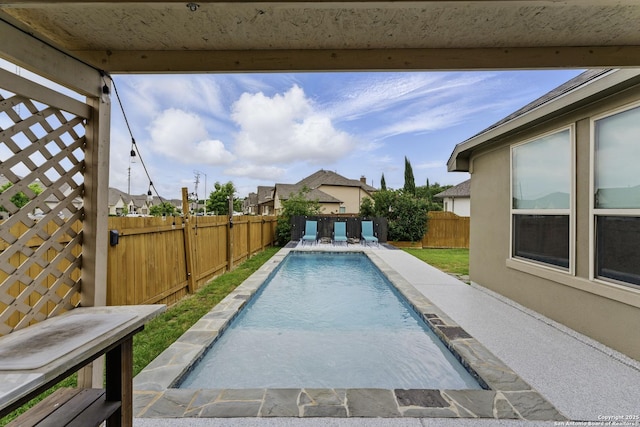 view of pool with a fenced backyard, a fenced in pool, and a patio