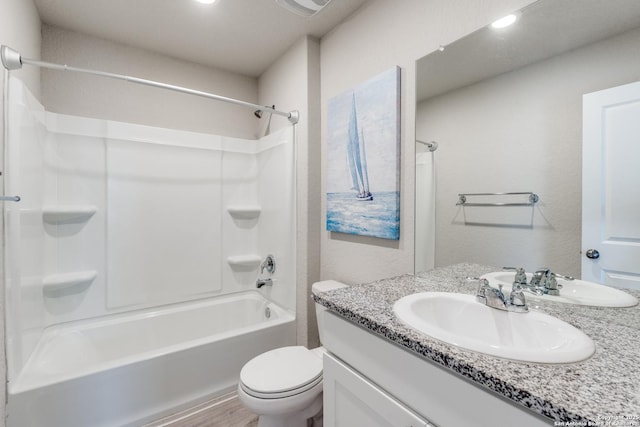 full bathroom with vanity, bathtub / shower combination, and toilet