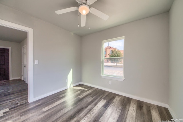 unfurnished room featuring baseboards, a ceiling fan, and wood finished floors