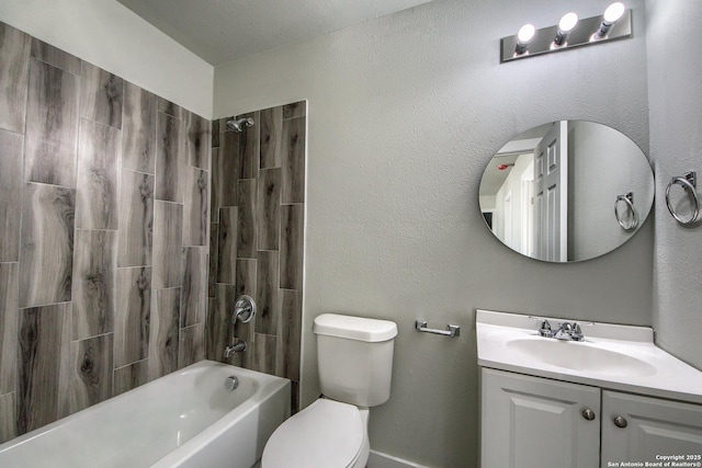 bathroom featuring toilet, washtub / shower combination, and vanity
