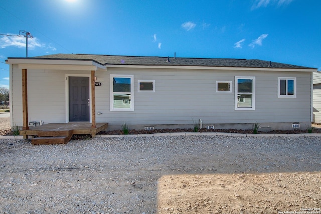 back of property with crawl space