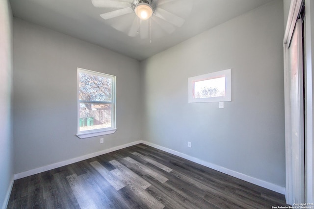 unfurnished room featuring baseboards, a ceiling fan, and dark wood-style flooring