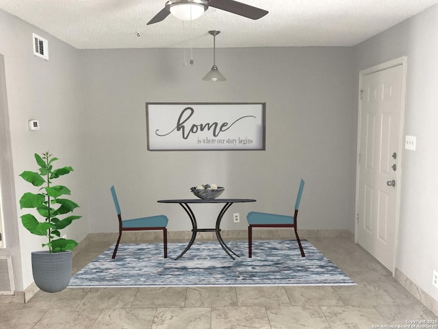4949 Hamilton Wolfe Unit 8104, San Antonio, TX 78229 - dining area featuring visible vents, a ceiling fan, baseboards, and a textured ceiling