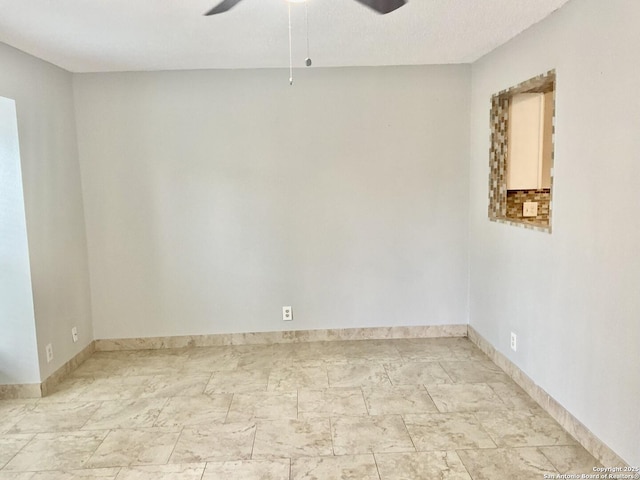 4949 Hamilton Wolfe Unit 8104, San Antonio, TX 78229 - empty room with baseboards and ceiling fan