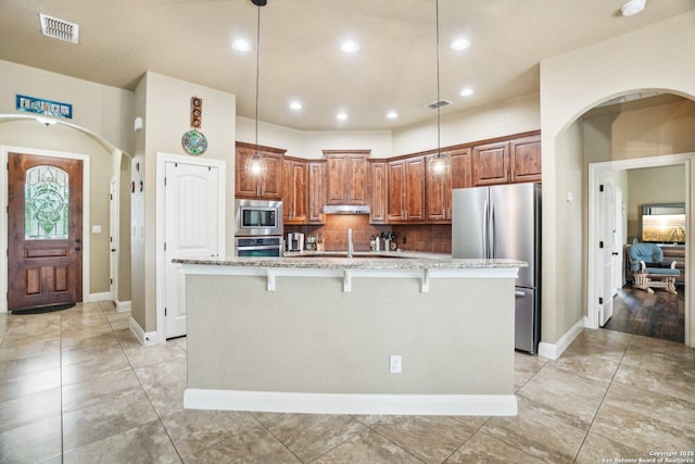 13139 Compass Rose, San Antonio, TX 78263 - kitchen with stainless steel appliances, baseboards, visible vents, and light stone counters