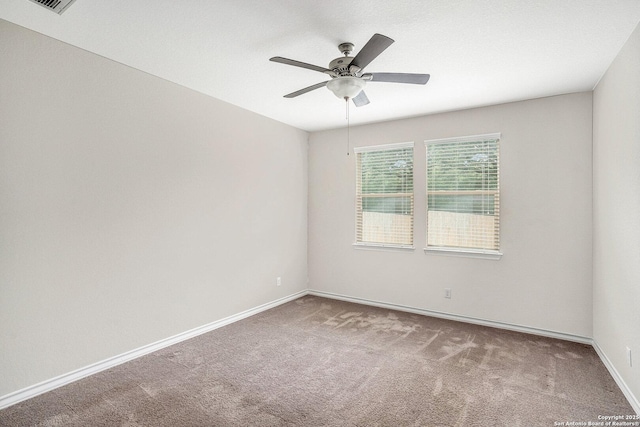 12448 Big Valley Crk, San Antonio, TX 78254 - carpeted spare room with baseboards and ceiling fan
